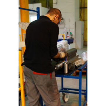 A Hibon worker conducting repairs on rotary positive displacement blowers at the Hibon factory in Wasquehal.